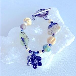 Silver and Green Beaded Bracelet with Sun Flower Charm. 6 1/2 inches in length